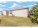 Side and rear exterior view of the home's yard showing the exterior siding at 308 Emmalee Pl, The Villages, FL 32162