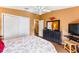 Bedroom featuring a ceiling fan, wood floors, and neutral colors at 308 Emmalee Pl, The Villages, FL 32162