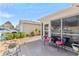 Relaxing patio area with comfortable seating, offering a serene outdoor living space at 308 Emmalee Pl, The Villages, FL 32162