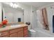 Bathroom featuring a single sink with a wood cabinet and a shower/tub combination at 3356 Blaise Ter, The Villages, FL 32163