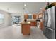 Kitchen with stainless steel refrigerator and sliding door to back patio at 3356 Blaise Ter, The Villages, FL 32163