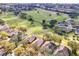 Aerial view of a home with a pool near a golf course at 3782 Avon Ct, Clermont, FL 34711