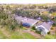 Aerial view of residential homes with screened patios and lush landscaping at 3782 Avon Ct, Clermont, FL 34711