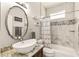 Stylish bathroom with a marble counter, vessel sink, and modern fixtures at 3782 Avon Ct, Clermont, FL 34711