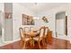 Elegant dining area with a wooden table, pendant lighting, and tasteful decor, perfect for entertaining at 3782 Avon Ct, Clermont, FL 34711