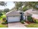 Charming single-story home features a paved driveway and manicured landscaping at 3782 Avon Ct, Clermont, FL 34711