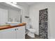 This bright bathroom offers a vessel sink, wood countertop, and modern toilet at 3901 Woodglade Cv, Winter Park, FL 32792