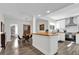 Open kitchen with white cabinets, butcher block countertops, and modern appliances at 3901 Woodglade Cv, Winter Park, FL 32792