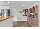 Kitchen area featuring custom coffee bar, stainless steel refrigerator and ample storage at 3901 Woodglade Cv, Winter Park, FL 32792