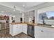 Bright kitchen with stainless steel appliances, white cabinets, and a butcher block island at 3901 Woodglade Cv, Winter Park, FL 32792