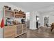 Kitchenette area with custom coffee bar, stainless steel appliances, and ample natural light at 3901 Woodglade Cv, Winter Park, FL 32792