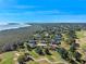 Golf course homes in an aerial view overlooking a lake at 39131 Griffin Lndg, Lady Lake, FL 32159