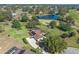 Scenic aerial view of house on golf course with tranquil lake at 39131 Griffin Lndg, Lady Lake, FL 32159