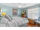 Comfortable bedroom featuring wood floors, a ceiling fan, and a small dresser at 39131 Griffin Lndg, Lady Lake, FL 32159