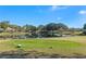 Scenic golf course view with lake, trees, and neighborhood homes at 39131 Griffin Lndg, Lady Lake, FL 32159