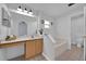 Bright primary bathroom featuring tile floors, a large mirror, a bathtub, and a separate toilet room for added privacy at 406 Bramble Way, Minneola, FL 34715