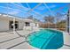 Relaxing screened pool with ample patio space that connects seamlessly to the home at 406 Bramble Way, Minneola, FL 34715