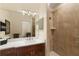 Bathroom showcases a wood vanity, shower, and modern fixtures at 415 Carman Dr, Leesburg, FL 34748