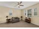 Bedroom with warm paint, bright ceiling fan, and plenty of natural light at 415 Carman Dr, Leesburg, FL 34748