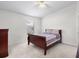 Inviting bedroom featuring neutral carpet, ceiling fan, and plenty of natural light from the window at 464 Dominish Estates Dr, Apopka, FL 32712