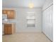 Bright eat-in kitchen featuring white appliances, wood cabinets, and closet pantry at 464 Dominish Estates Dr, Apopka, FL 32712