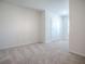 Bright bedroom with carpeting, neutral walls, and a double door closet at 5391 Dragonfly Dr, Wildwood, FL 34785