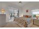 Bright bedroom has a sliding glass door leading to the outdoor lanai at 5428 Tangelo St, Leesburg, FL 34748