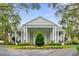 Elegant community clubhouse framed by mature trees and manicured landscaping at 5428 Tangelo St, Leesburg, FL 34748