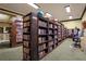 Cozy library with floor to ceiling bookshelves and comfortable seating at 5428 Tangelo St, Leesburg, FL 34748