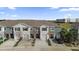 Birds eye view of multi Gathering home with one-car garages and driveways, surrounded by palm trees and lush landscaping at 5435 Dragonfly Dr, Wildwood, FL 34785