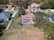 Aerial shot of a home with a screened-in pool, lush greenery, and a well-maintained lawn at 5746 Crestview Dr, Lady Lake, FL 32159