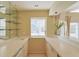 A wet bar with white countertops, glass shelving, and a window overlooking the pool at 5746 Crestview Dr, Lady Lake, FL 32159