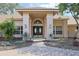 Elegant entryway of a single-Gathering home featuring a brick walkway and a double door, creating a welcoming ambiance at 5746 Crestview Dr, Lady Lake, FL 32159