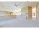 Upstairs living room with pendant lights, tile floor entrance, and a view of kitchen at 5746 Crestview Dr, Lady Lake, FL 32159