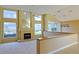 Living room with fireplace, high windows, and a view of kitchen at 5746 Crestview Dr, Lady Lake, FL 32159