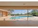 Beautiful screened-in pool with sunny lanai, lush green views and secure handrails for safe, carefree enjoyment at 5746 Crestview Dr, Lady Lake, FL 32159