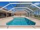 Inviting screened-in pool area with a spacious deck, perfect for outdoor relaxation and entertaining at 5746 Crestview Dr, Lady Lake, FL 32159