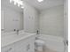 A bathroom featuring a tub, shower, and vanity at 68 Malauka Pass Crse, Ocklawaha, FL 32179