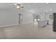 Bright and airy living room showcasing a modern, open-concept design with sleek floors at 68 Malauka Pass Crse, Ocklawaha, FL 32179