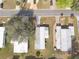 Aerial view highlighting the homes layout, landscaping, and roof structure at 730 Royal Palm Ave, The Villages, FL 32159