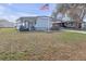 Inviting single-story home with a well-kept lawn and charming front porch, offering a cozy and welcoming curb appeal at 730 Royal Palm Ave, The Villages, FL 32159