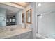 Well-lit bathroom features a white vanity, a sink, and a glass-enclosed shower stall at 8 Gallinule Ct, Fruitland Park, FL 34731