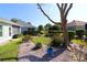 Backyard featuring lush garden beds and serene outdoor space at 8660 Se 132Nd Ln, Summerfield, FL 34491