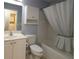 Bright bathroom with tub/shower combo, vanity, and ample storage space at 8660 Se 132Nd Ln, Summerfield, FL 34491