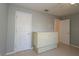 Bedroom with large closet and white murphy bed on tile flooring at 8660 Se 132Nd Ln, Summerfield, FL 34491