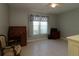 Bedroom featuring large window with a wooden desk and roll top at 8660 Se 132Nd Ln, Summerfield, FL 34491