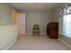 Spacious bedroom featuring neutral walls, tile flooring, and classic desk at 8660 Se 132Nd Ln, Summerfield, FL 34491