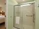 Clean shower with glass door in an updated bathroom at 8660 Se 132Nd Ln, Summerfield, FL 34491