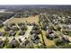 Aerial view of a neighborhood with mature trees, offering both privacy and shade at 887 Daisy Hill Ct, Apopka, FL 32712