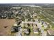 Aerial view of a neighborhood showcasing tree-lined streets and well-maintained homes at 887 Daisy Hill Ct, Apopka, FL 32712